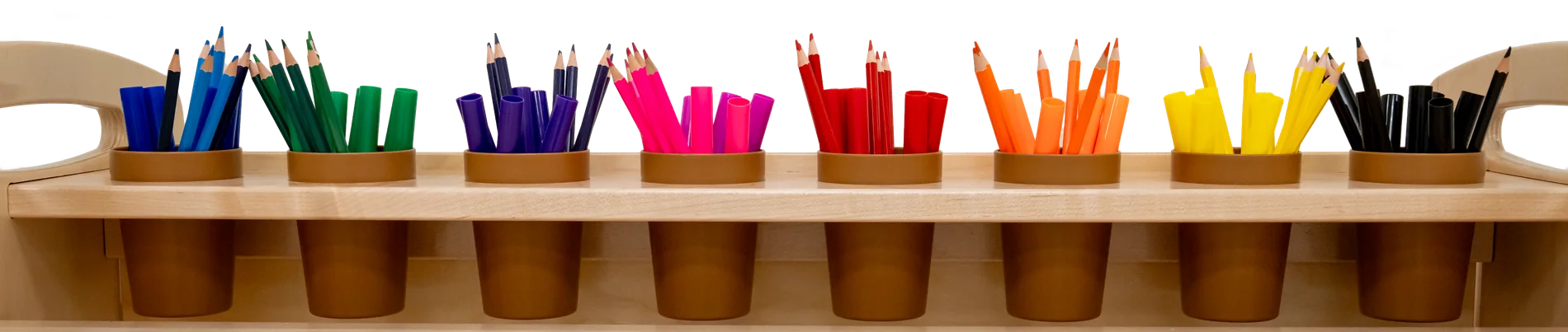 A row of colored pencils sorted by color